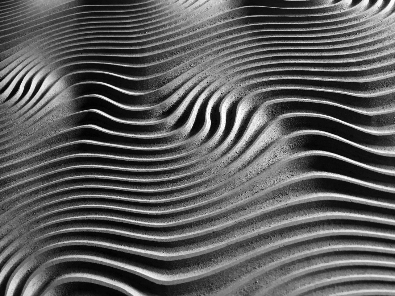 Gray spiral artwork; Photo by Ricardo Gomez Angel on Unsplash.